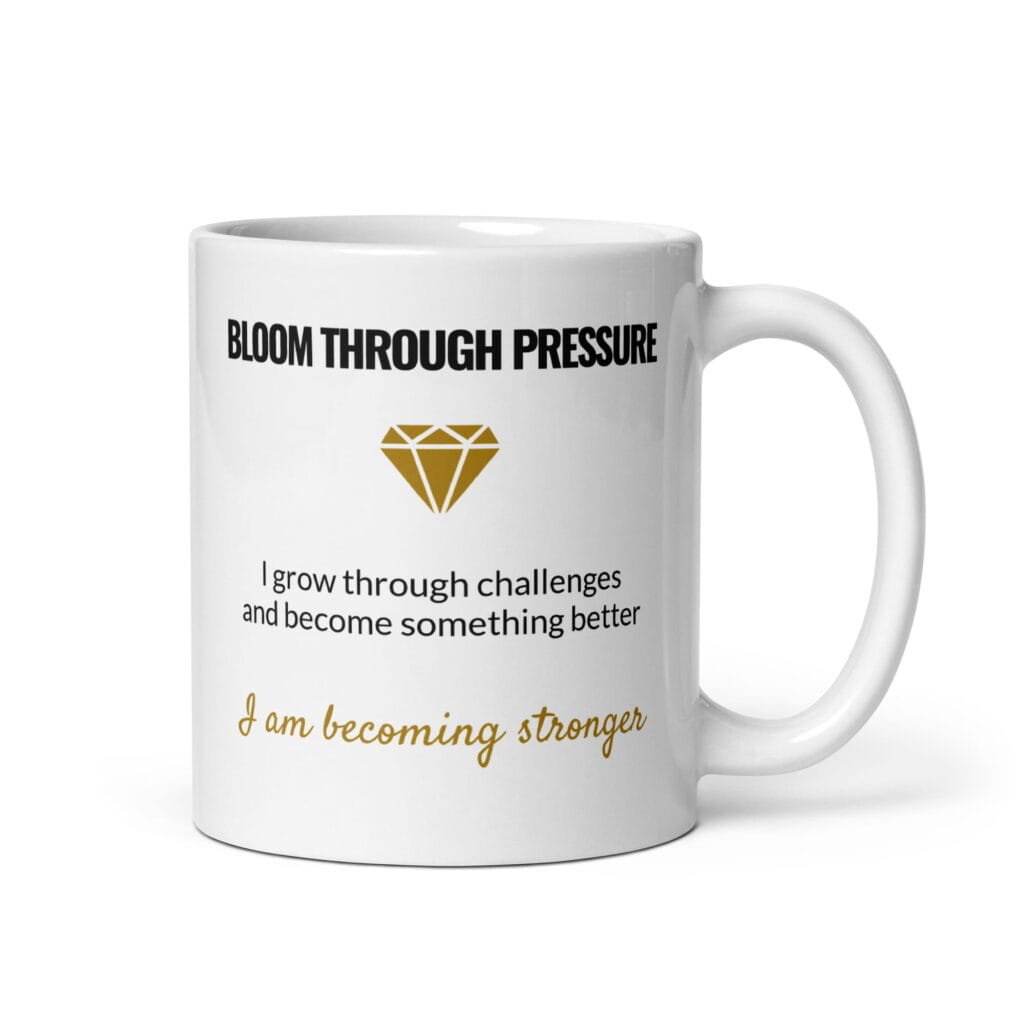 White ceramic Bloom Through Pressure affirmation mug with handle on the right