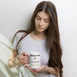 Bloom Through Pressure Mug, white ceramic 15 oz affirmation mug shown in a lifestyle setting